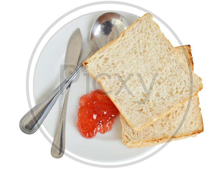 Toasted Bread With Jam Closeup in a Plate Over an Isolated White Background