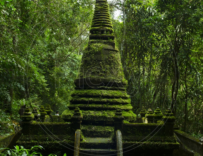 Old Pagoda covered with moss at Phlio waterfall national park in Chanthaburi Province Thailand