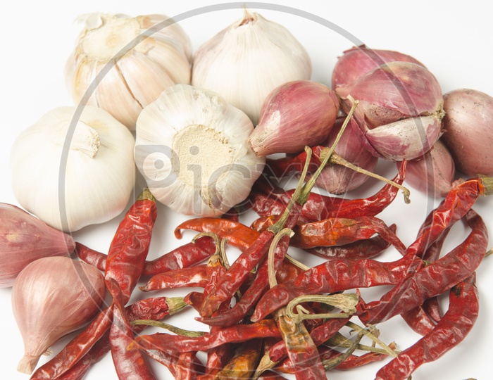 Red Chilies, Onions and Garlic on white background