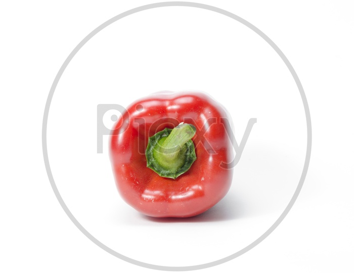 Bright red pepper isolated on white background