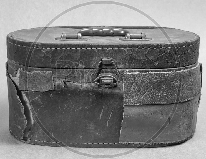 Old brown leather bag in black and white background
