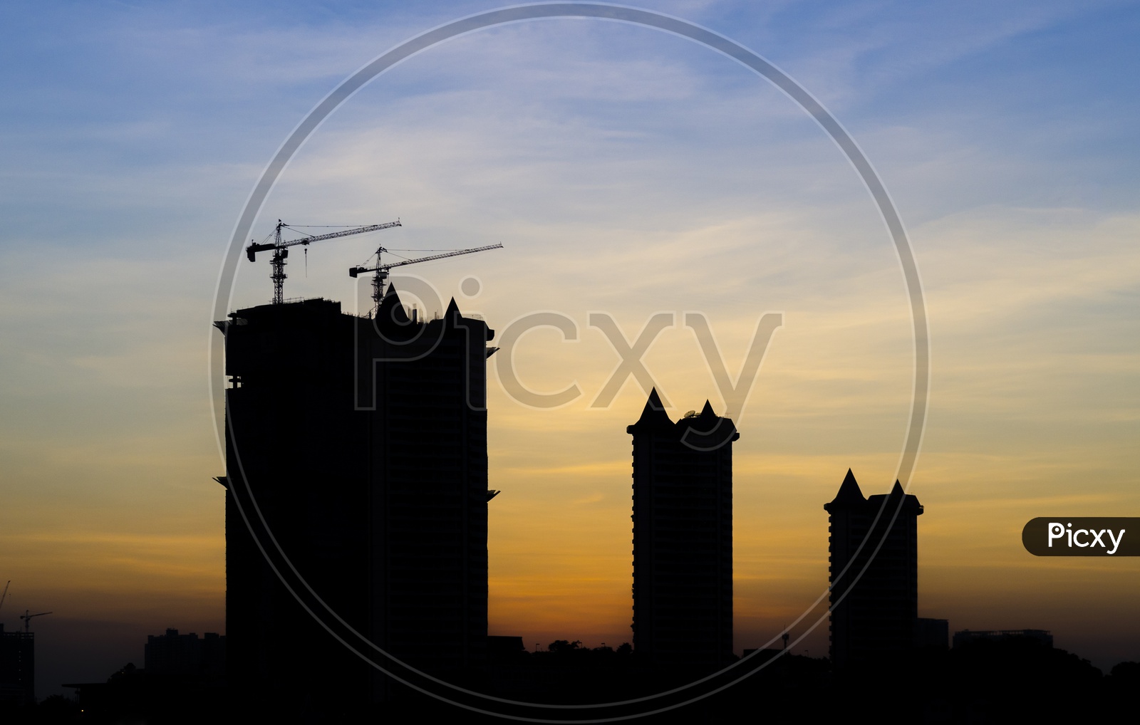 Silhouette of Thai Tower cranes during sunset