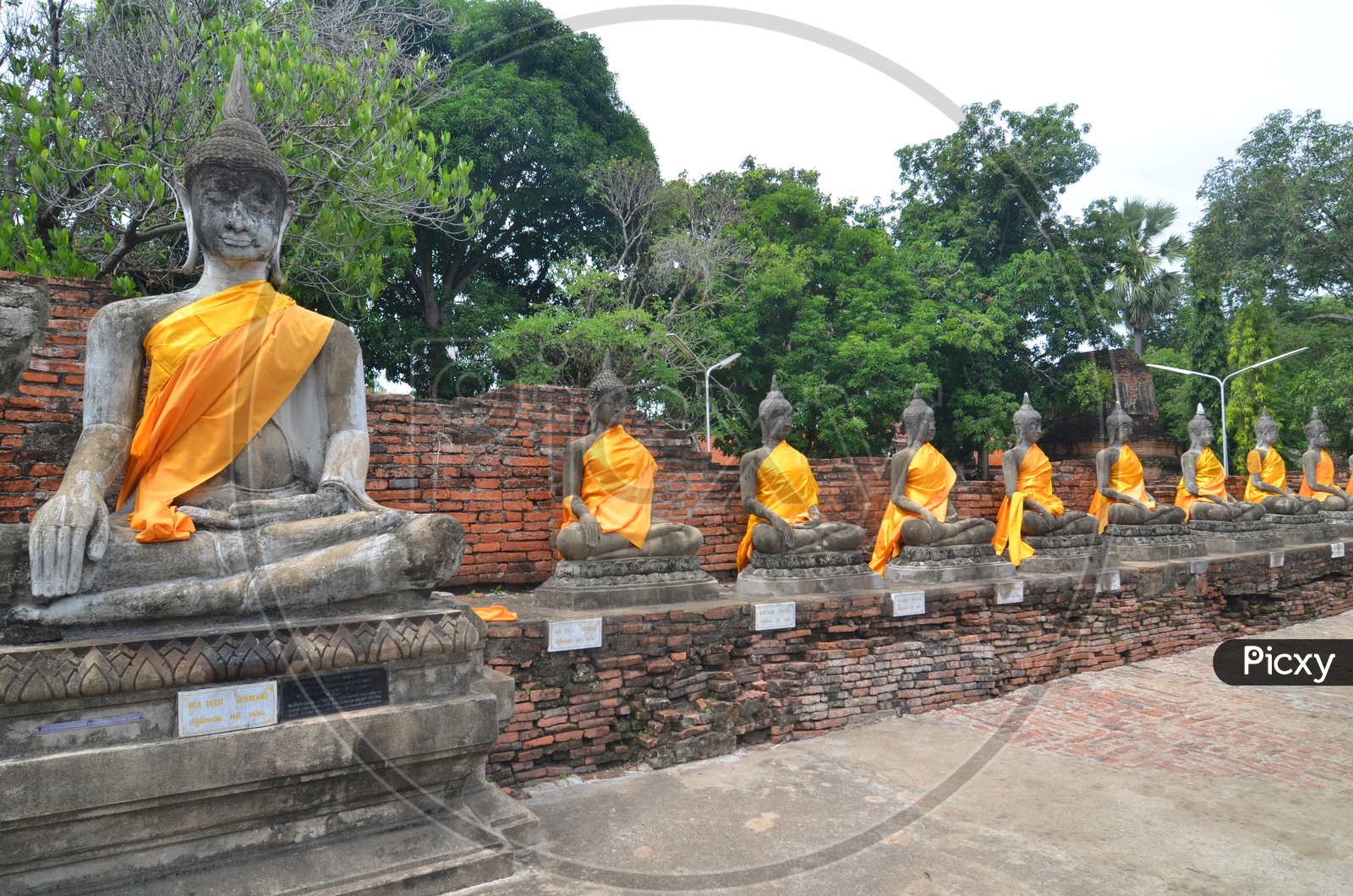 Ancient Buddha Statues O=and pagodas at  Wat Yai Chai Mongkol at Ayutthaya, Thailand