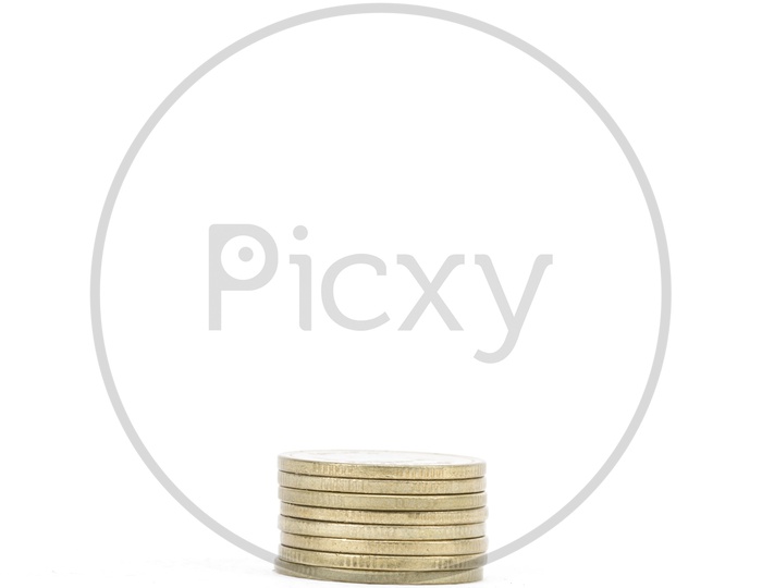 Golden Currency Coins Small  Column On an isolated White Background
