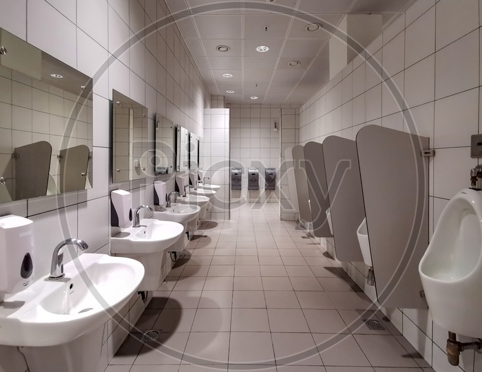 Gents Toilet Or Restroom In a Mall With Commode and Wash Basin