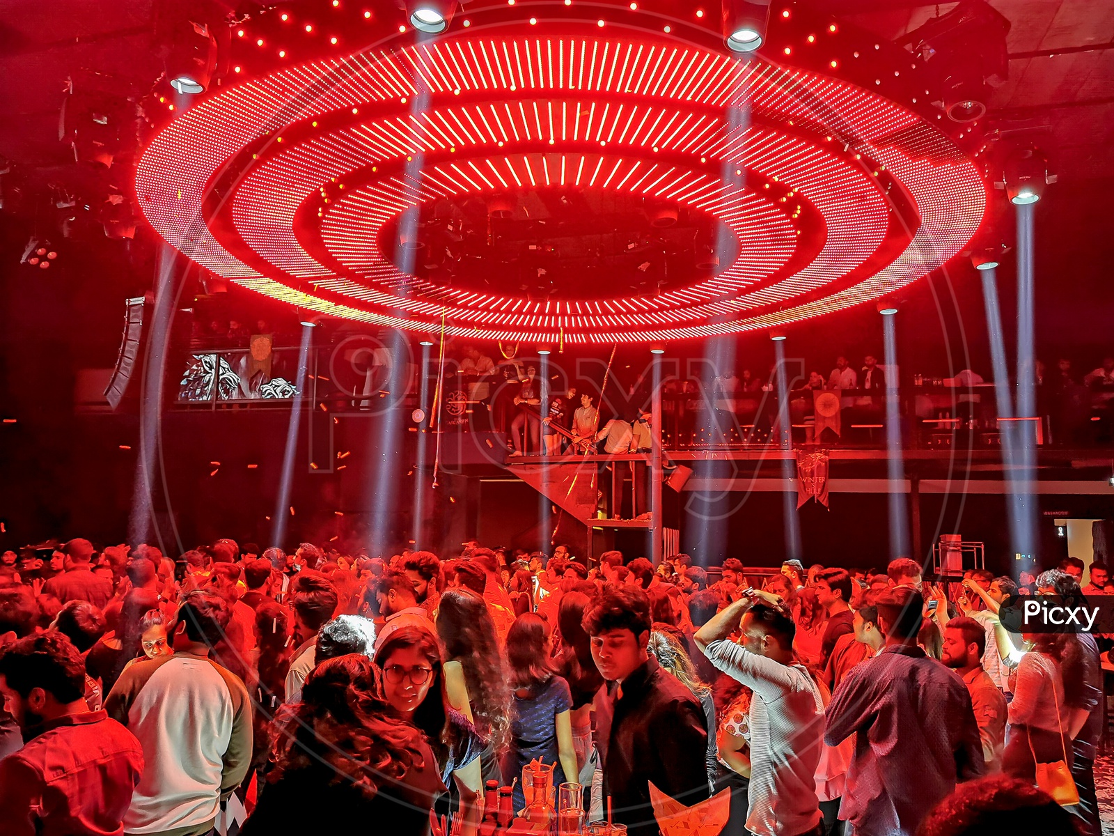 Crowd of People Having Fun and Enjoying Music By Dancing in  a Club Party