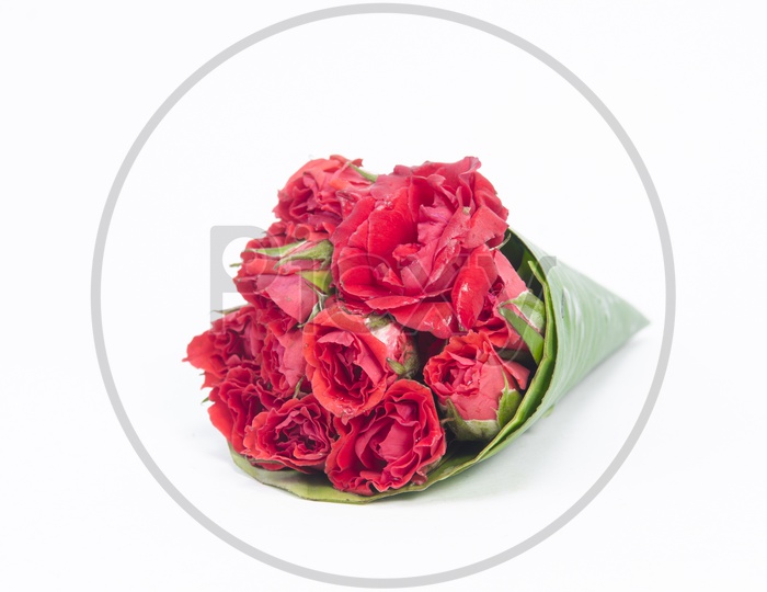 A Rose flower bouquet with Banana Leaf