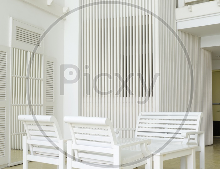 Vintage white chair and table in the room