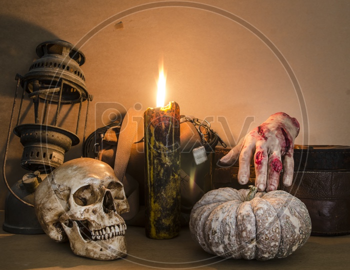 Halloween Party Items with human skull and burning candle