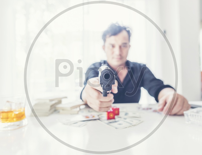 A businessman pointing a gun