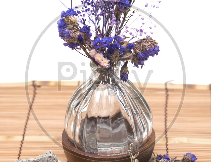 Dried vintage flowers with a stone in a cafe
