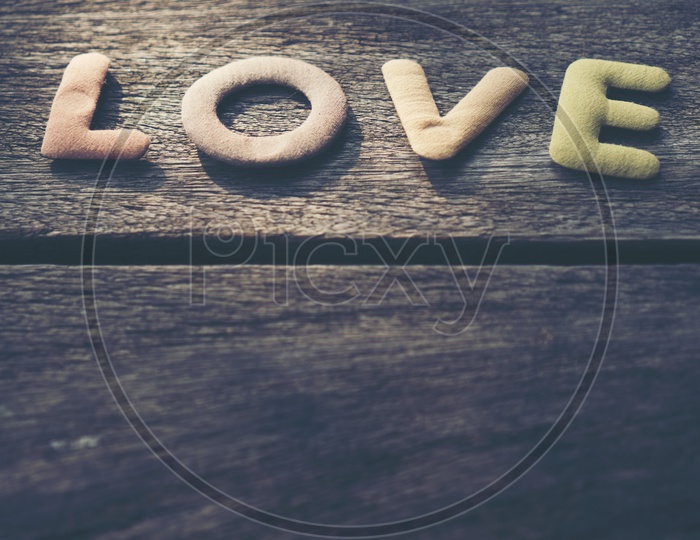 Word  LOVE With Wooden Plank Background For valentines Day Template With Copy space