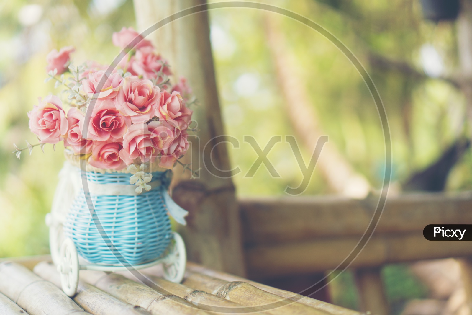 Rose Flower Vase on a Cafe Table Forming a Background
