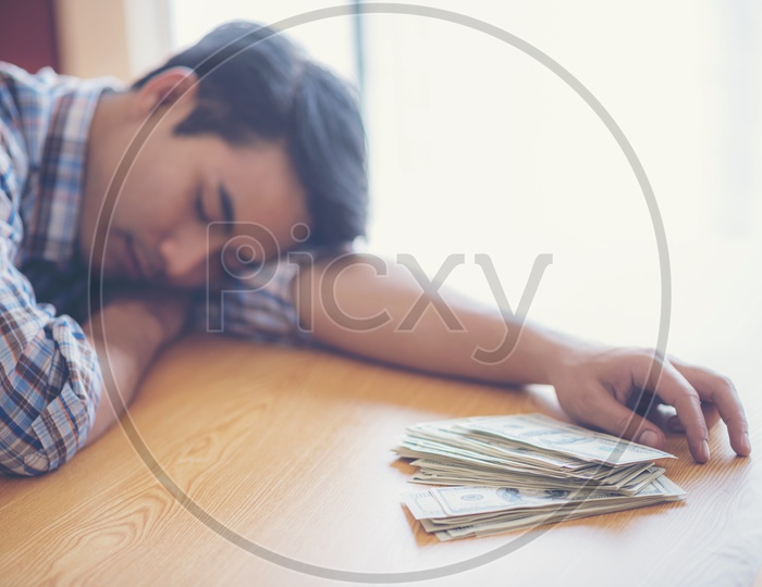A Businessman sleeping on the table
