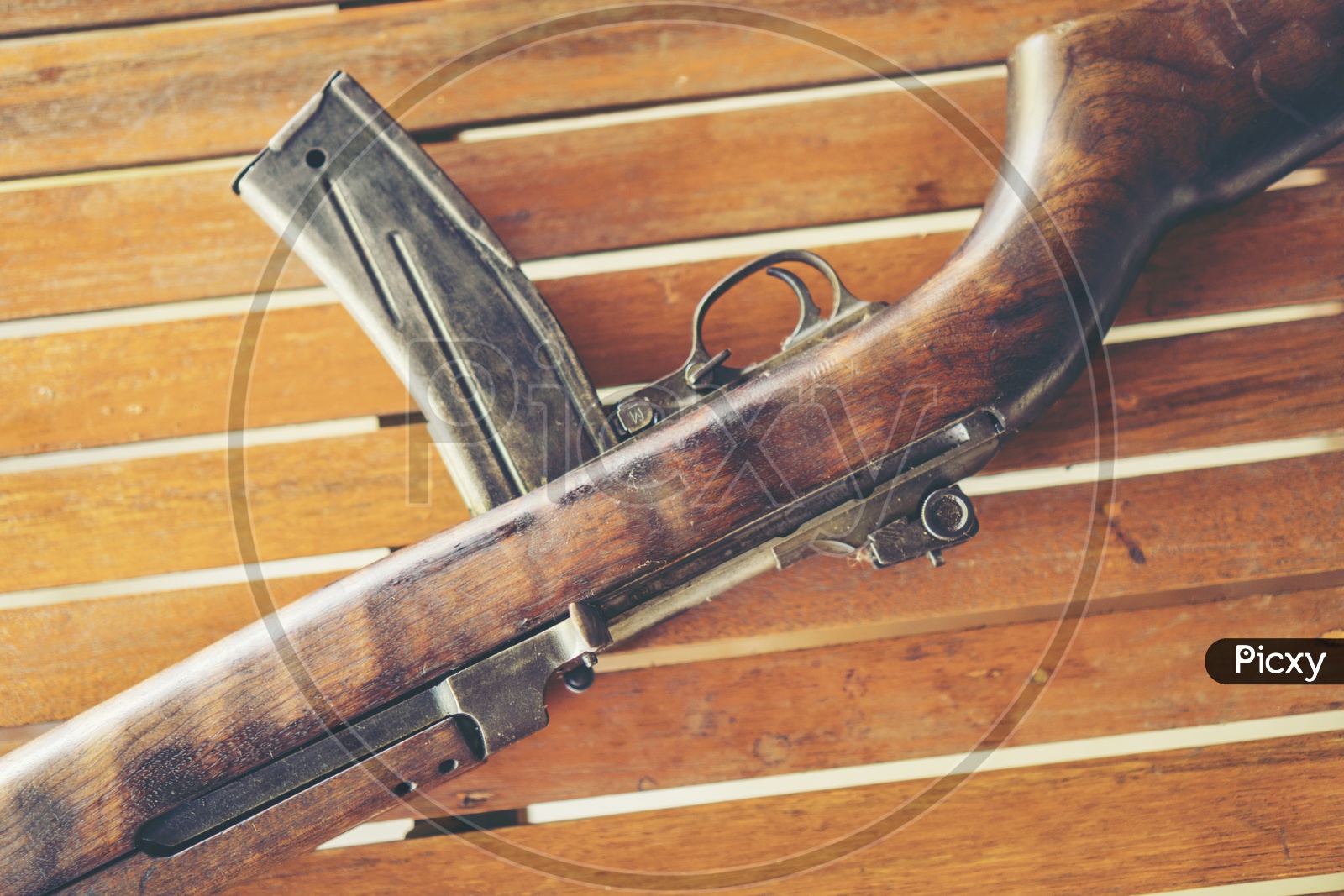 Vintage Wooden machine Gun or Shotgun  of World War II On a Wooden Table