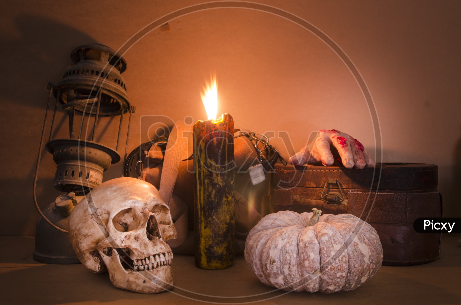 Human Skull with Burning Candle for Halloween