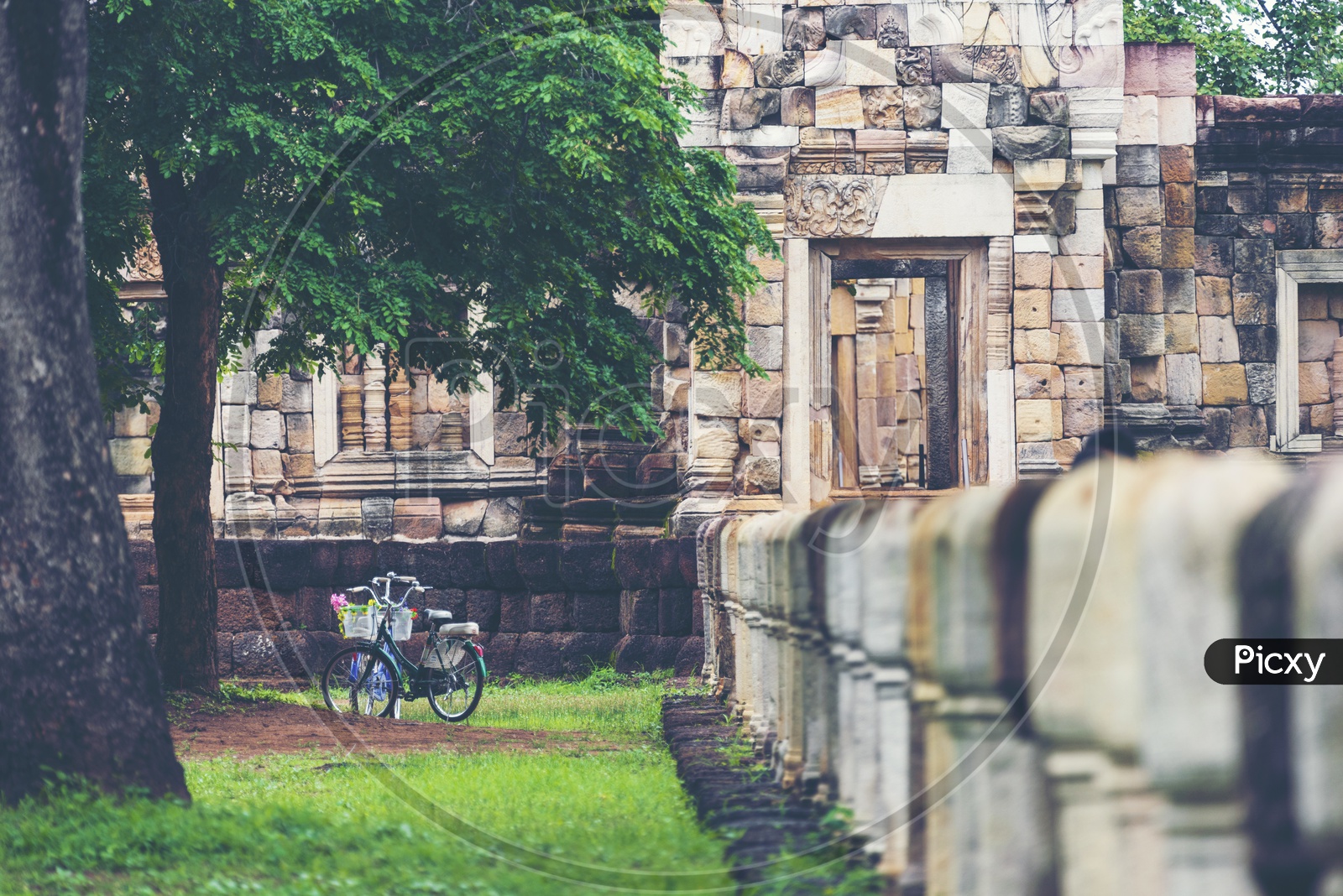 Bicycle At an Ancient Buddha Temple With Stones