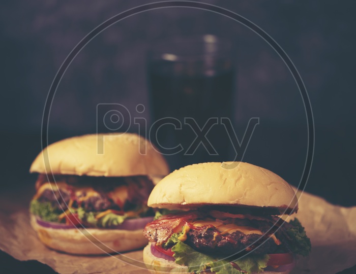 Close-up of home made tasty burgers on wooden table