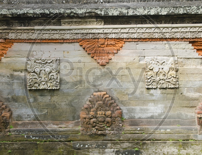 Stone carvings on Taman Ayun Temple in Bali.