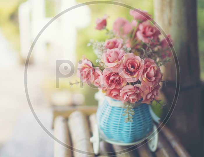 Rose Flower Vase on a Cafe Table Forming a Background