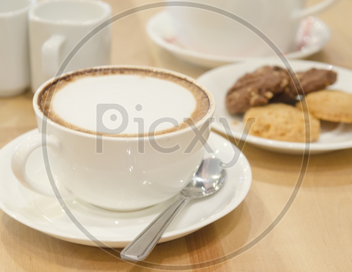 A Cappuccino served with cookies