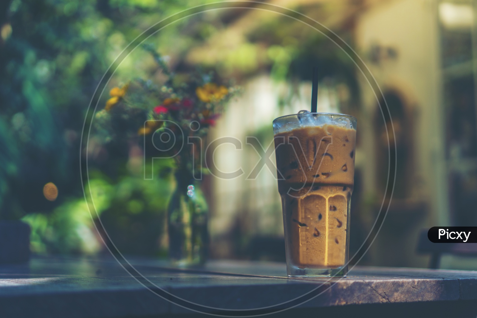 ice coffee glass on wooden table on a Cafe Table