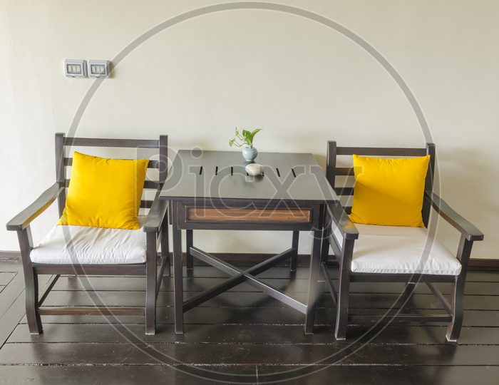 Vintage table and yellow chairs in Thailand