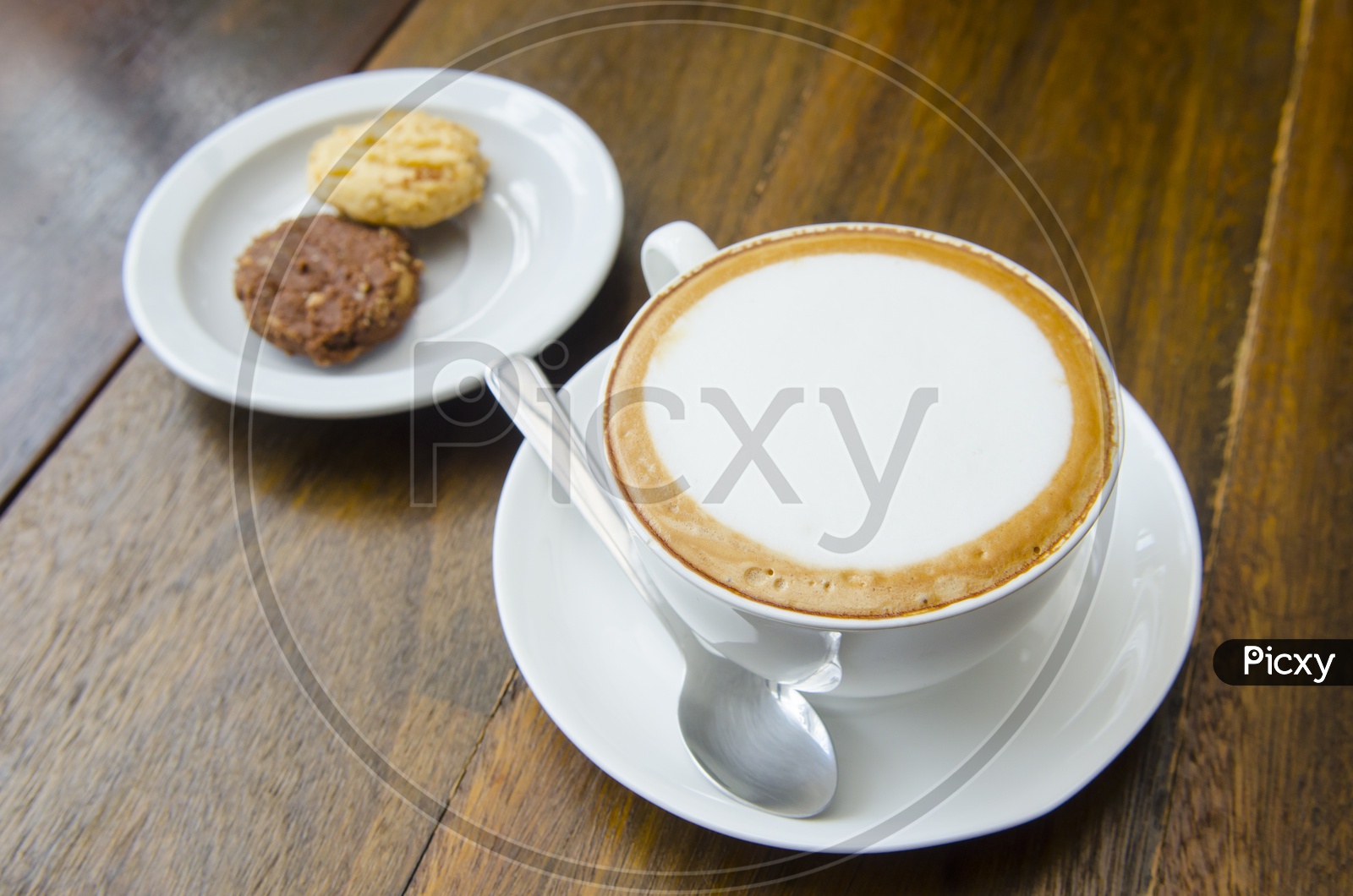 Coffee Served with cookies in Thai Cafe