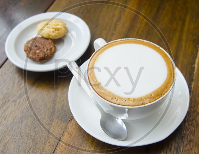 Coffee Served with cookies in Thai Cafe