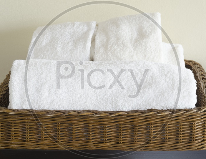close-up basket of pure white spa towels