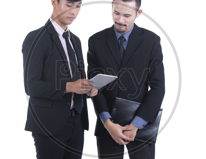 Couple Of Young Business Man Using Tablet  Gadget Over an Isolated White Background