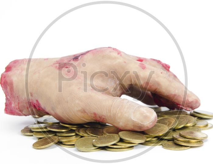 A Human Hand on the stack of coins