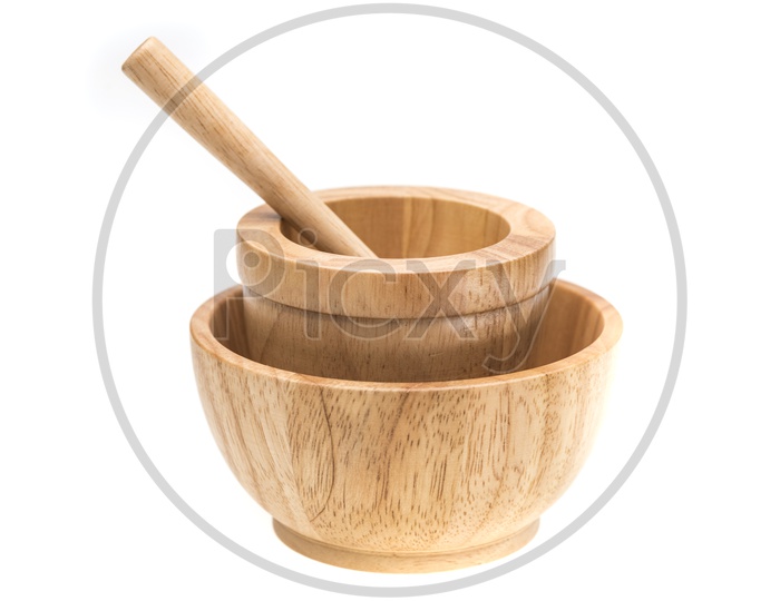 A Wooden Mortar in a bowl