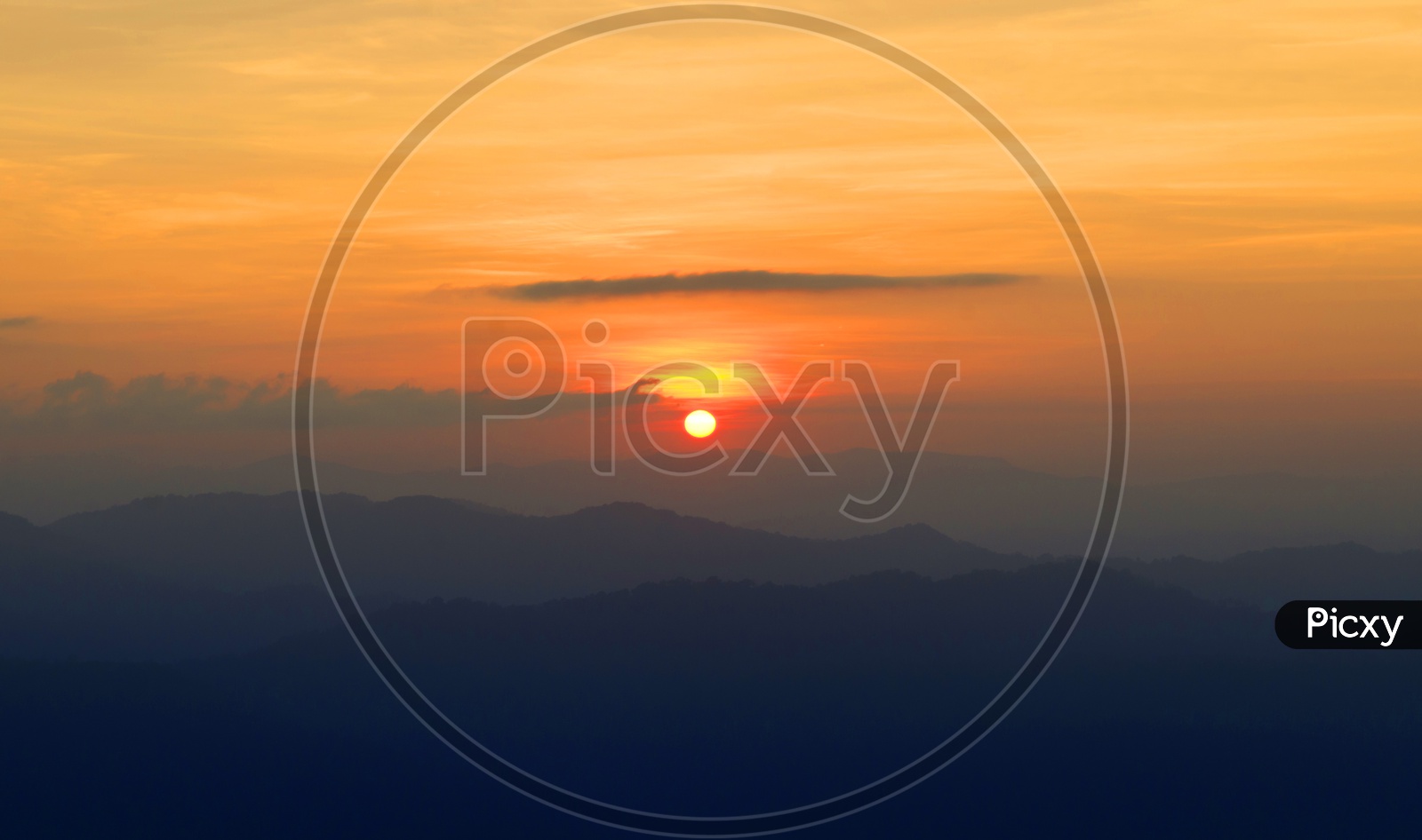 Sunset Over Mountain Landscapes With Golden  Hour Sky in Background