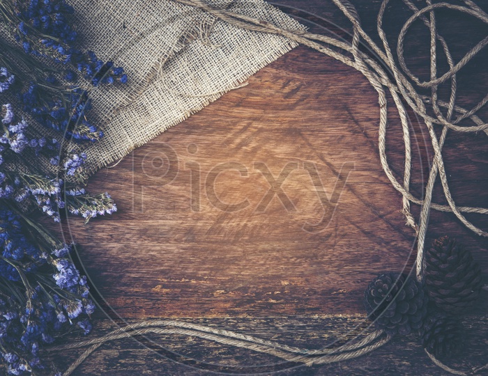 Dry flower frame on wood background