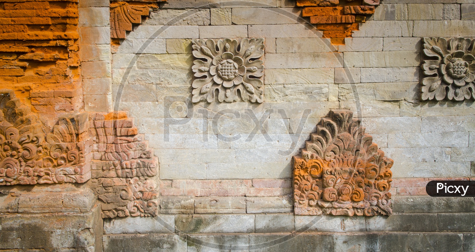 Stone carvings on the ancient wall in Thailand