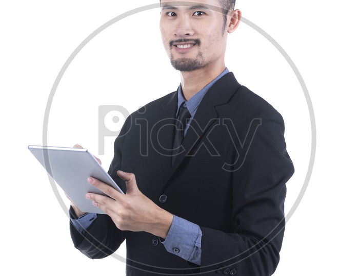 Young Businessman Using Tablet On an Isolated White Background