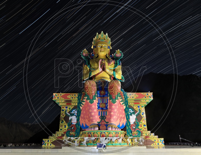 The Divine, Maitreya Buddha Statue With Star Trail