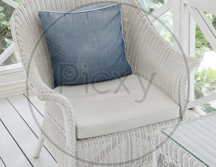 A Chair with blue pillow