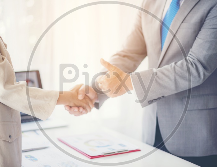 Businessmen shaking hands as a sign of approval