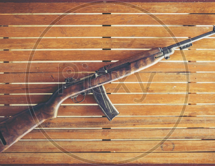 Machine Gun Or Shotgun Used in World War II On an Wooden Table