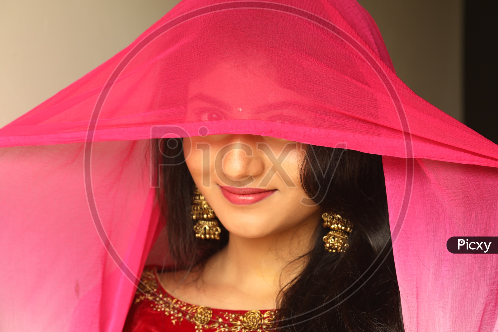 Indian girl smiling showing her half face