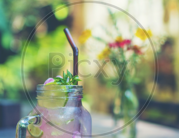 Summer Quenchers or Mocktail On a Cafe Table Background