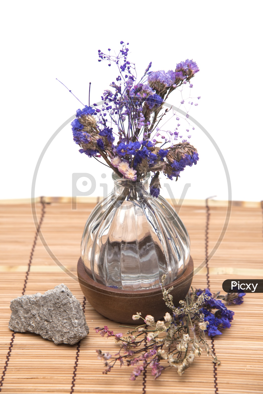 Dried vintage flowers with a stone in a cafe