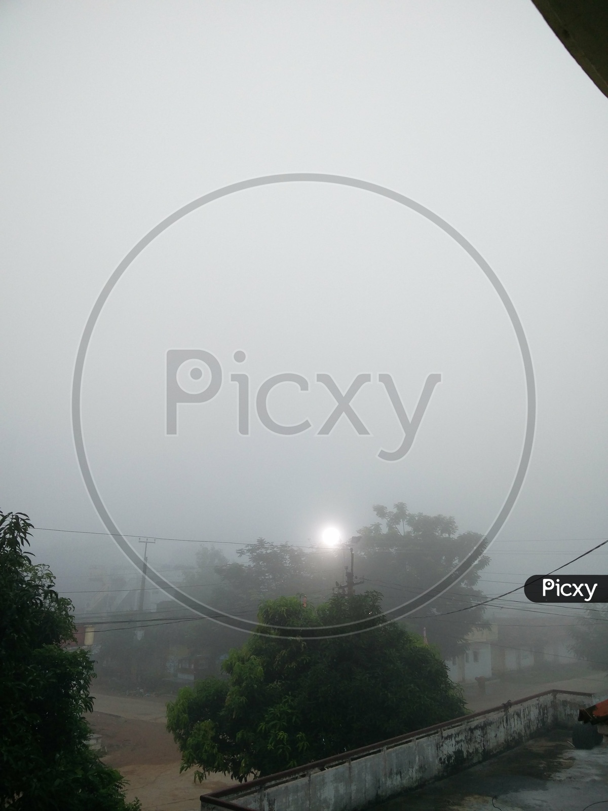 Fog Over a Village In Early Morning