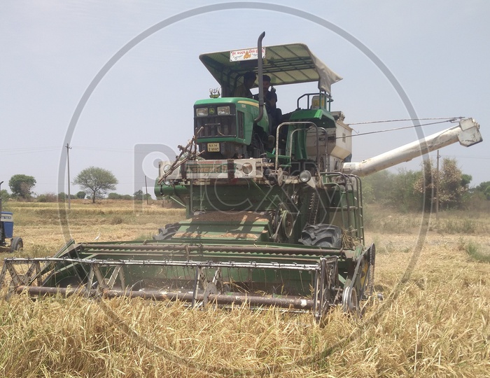 A Tractor or Harvester in Agriculture Field