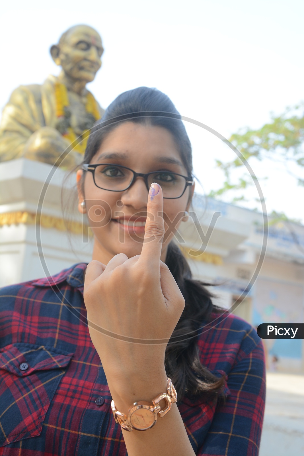 Young Woman  Voter Showing inked Finger After Casting Her Vote in General Elections
