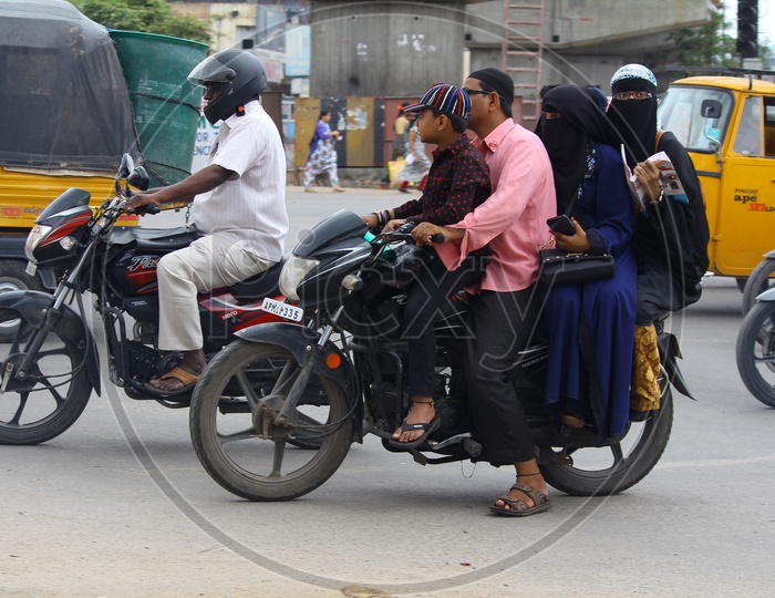 City Commuter Traffic Rules Violation With Triple Riding in Hyderabad City Roads