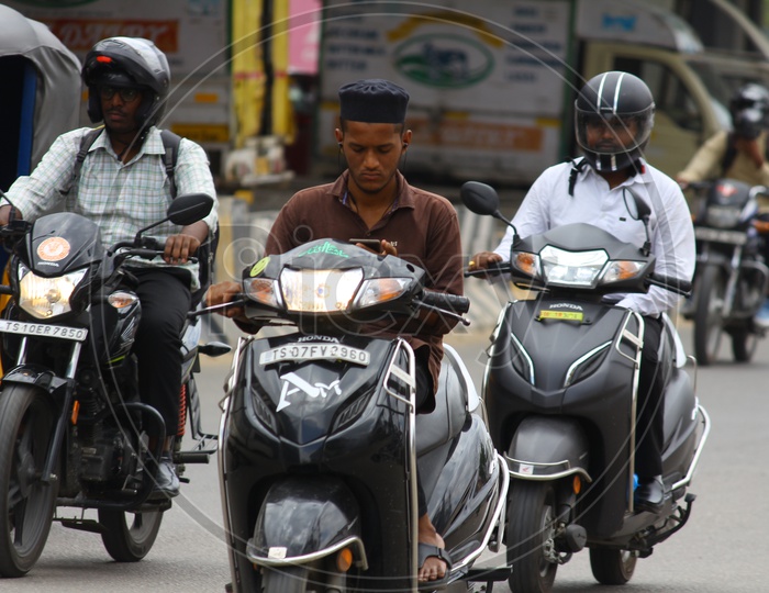 Traffic Rules Violation By Using Cellphone While Commuting in Bike on Hyderabad City Roads