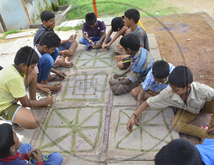 Image of Young Children Playing Board Games In Rural Indian VillagesRF088016Picxy
